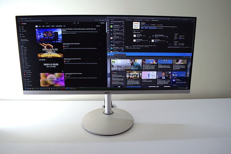 Black Acer ultrawide monitor on a white desk