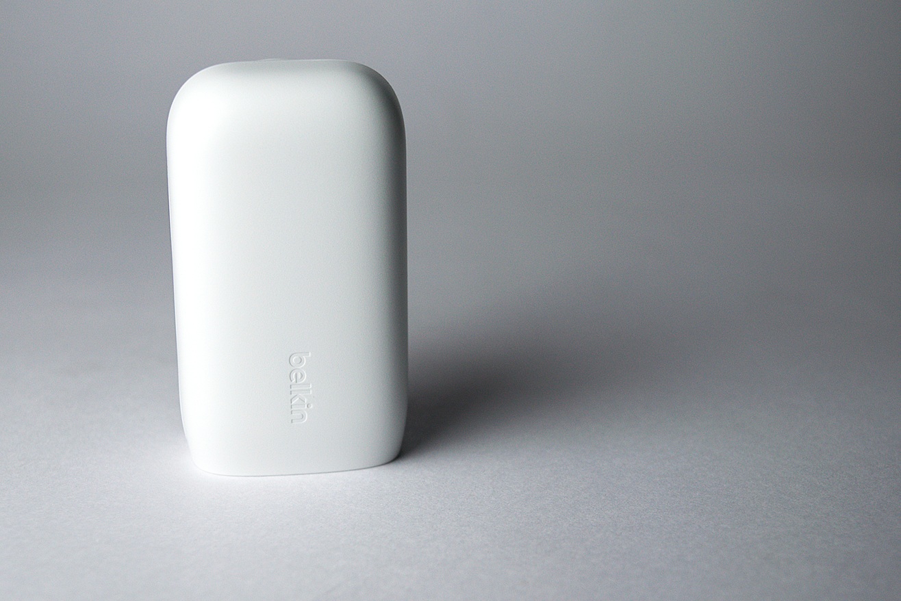 White Belkin power charger on a desk