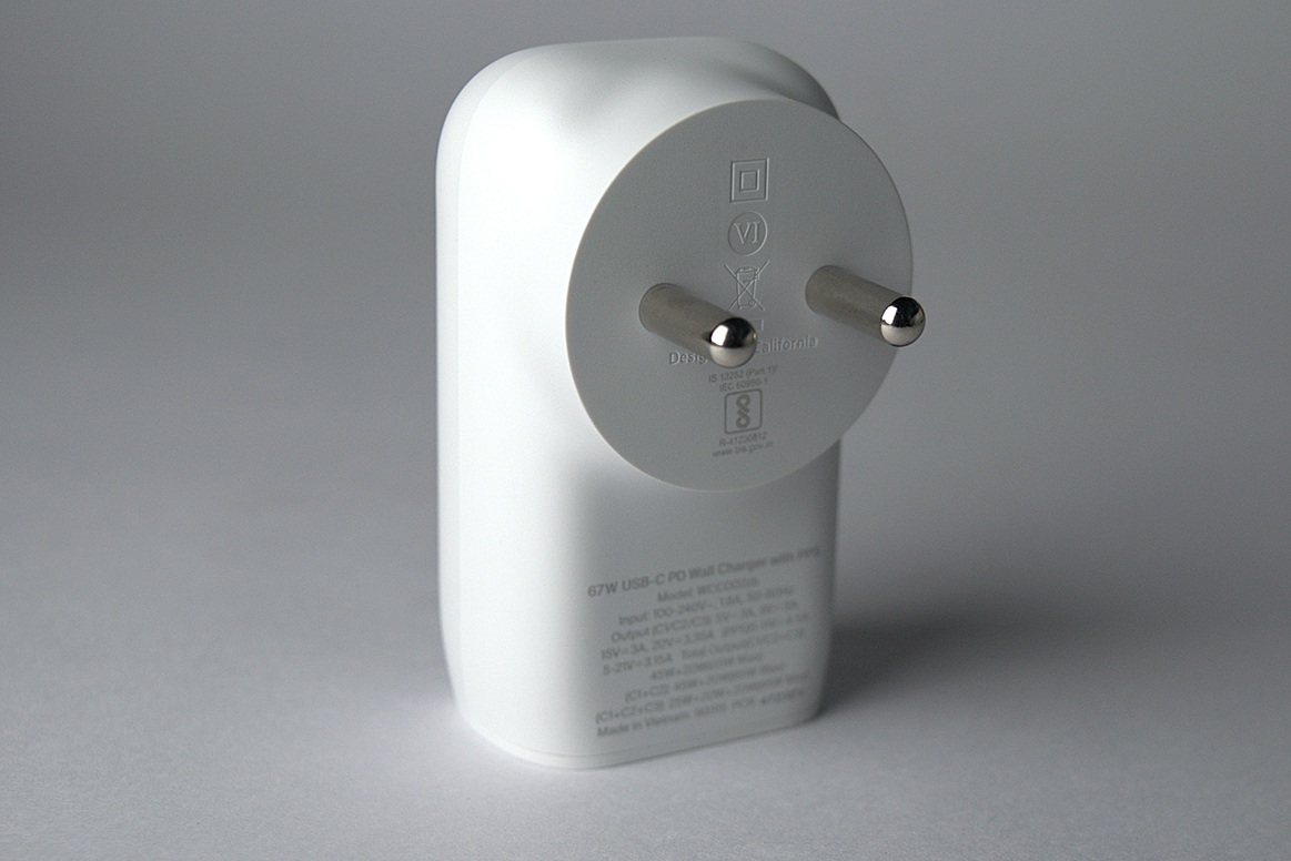 White Belkin power charger on a white desk