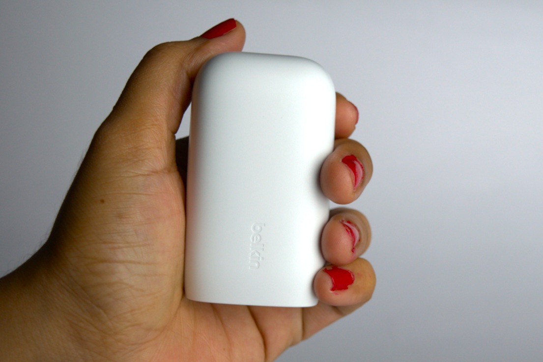 White Belkin power charger is so compact that it fits in your palm