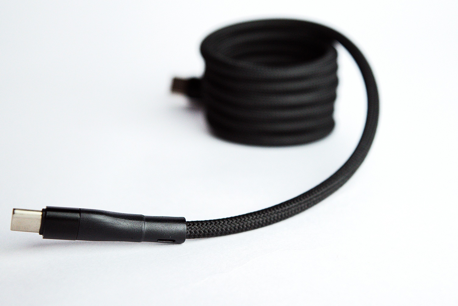 USB-C pin of a magnetic braided coiled power cable