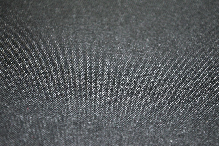 Close up view of the pattern on a fabric gaming desk mat