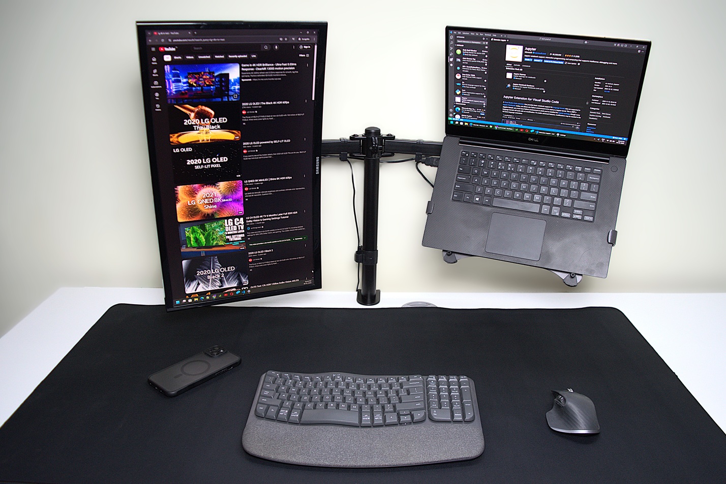 Workspace setup with a gaming desk mat