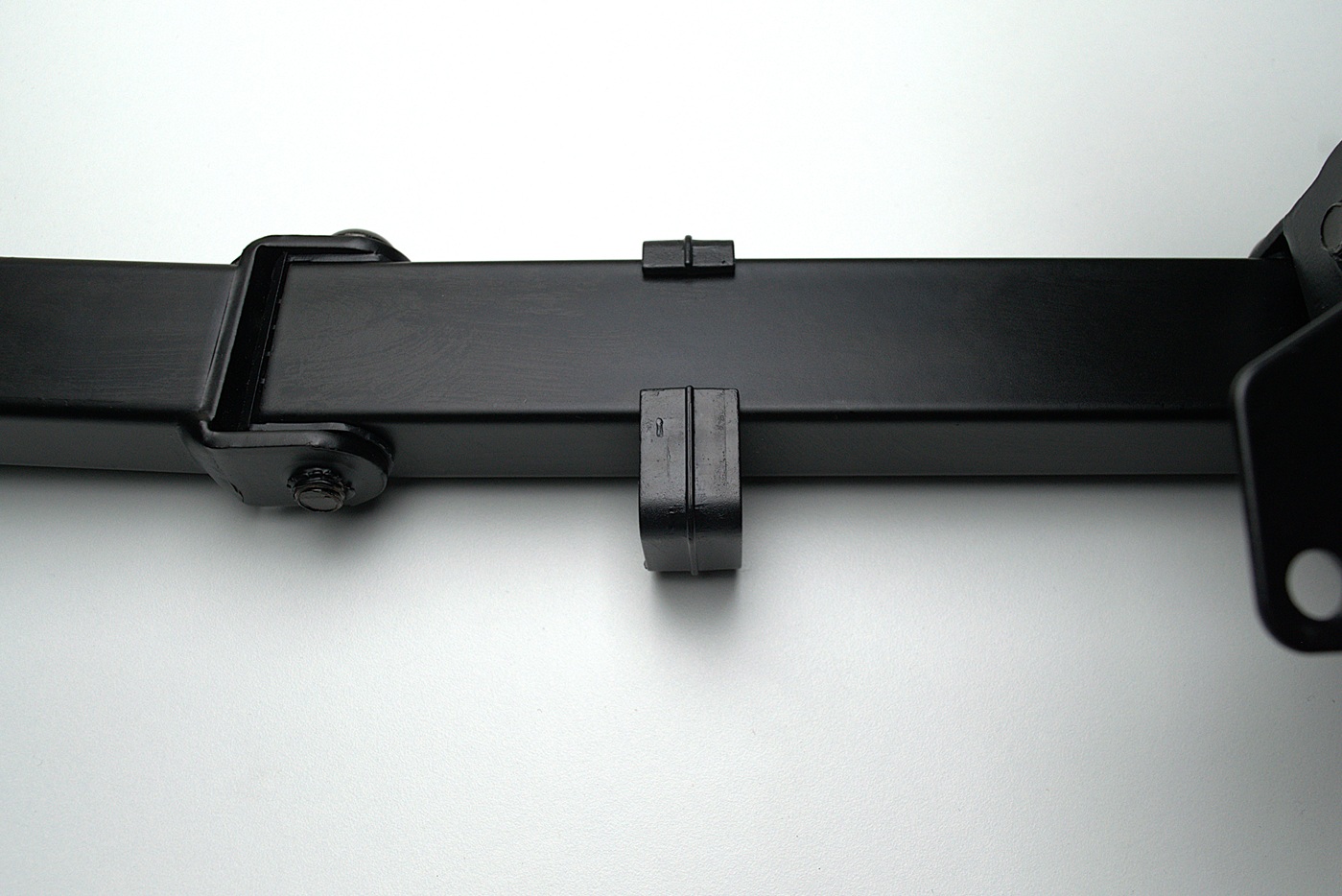 A cable clip on a monitor arm