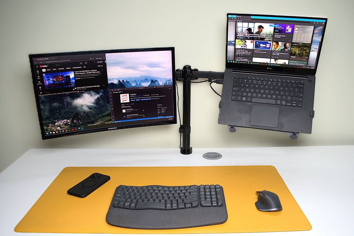 Laptop and a monitor on a dual arm setup