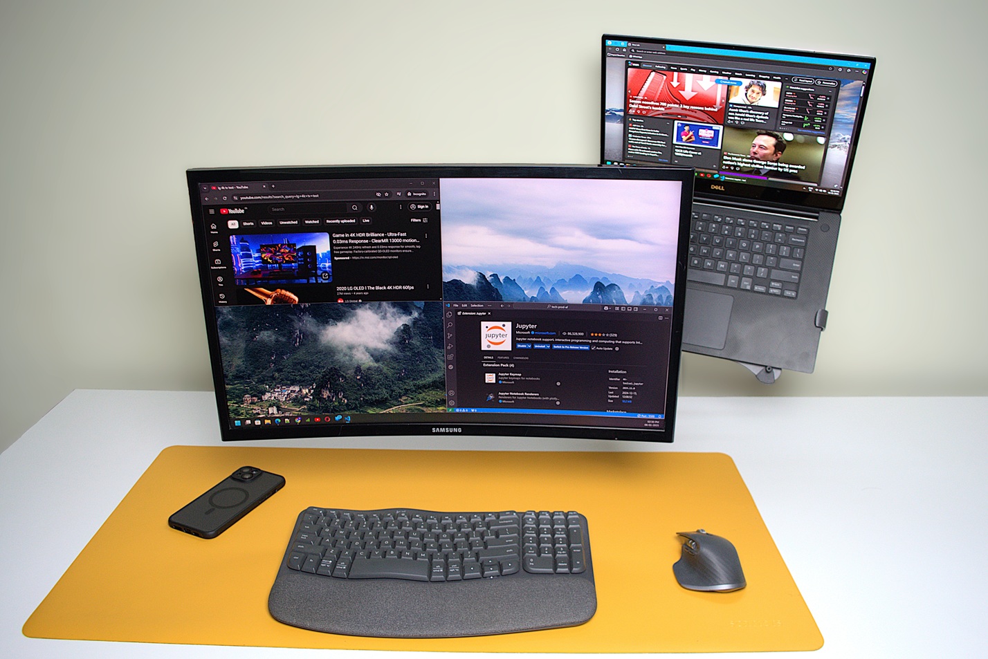 Laptop and a monitor on a dual arm setup, monitor pulled forward