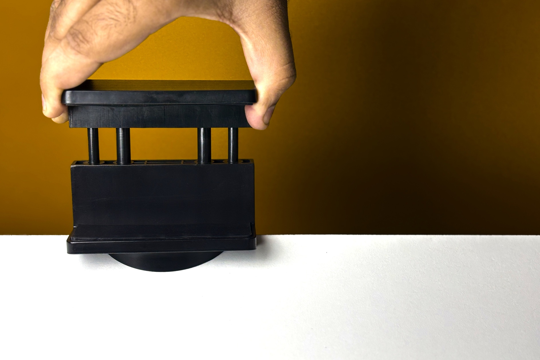 Power strip holder pulled up to its maximum height accommodation