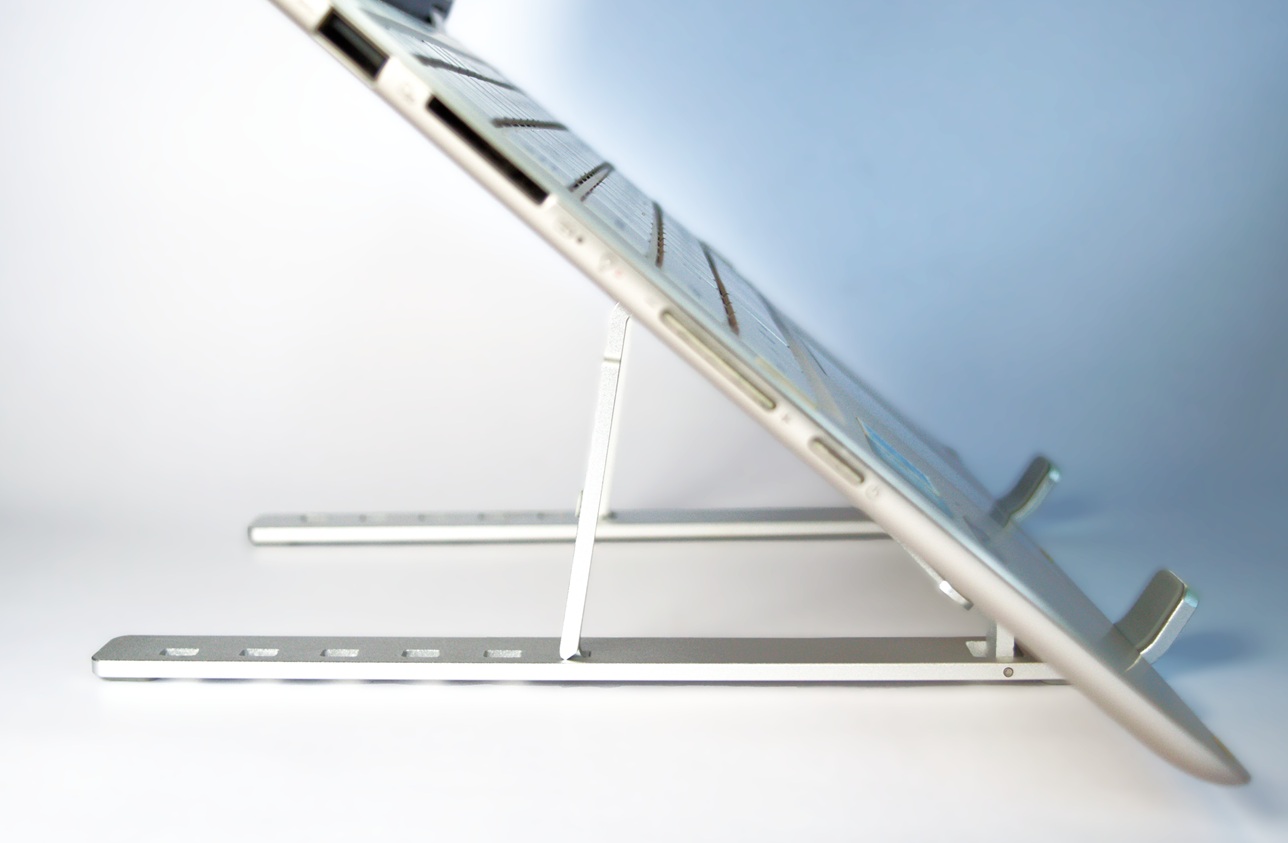 Open Asus laptop on the laptop stand at its top elevation