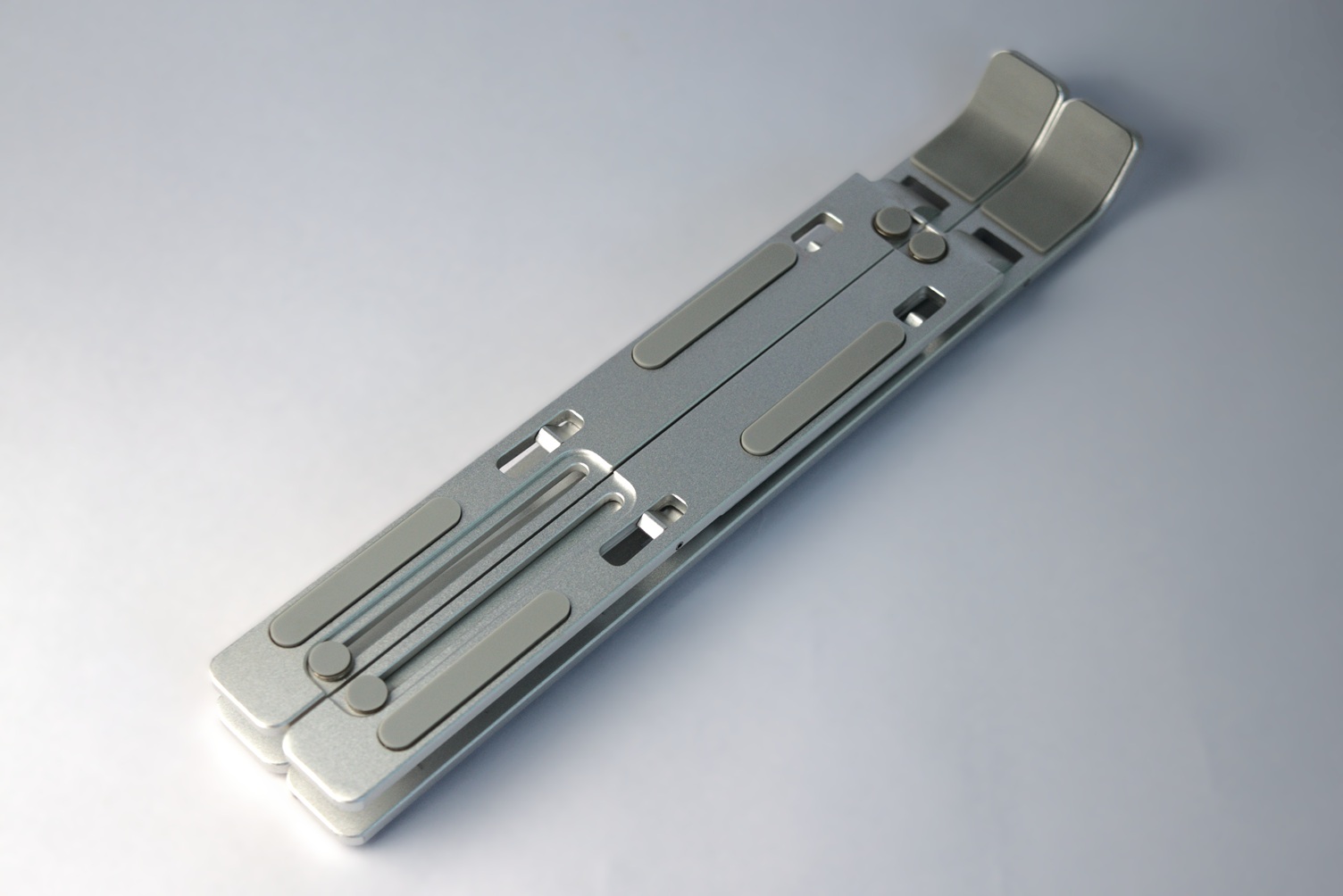 Laptop stand in collapsed position