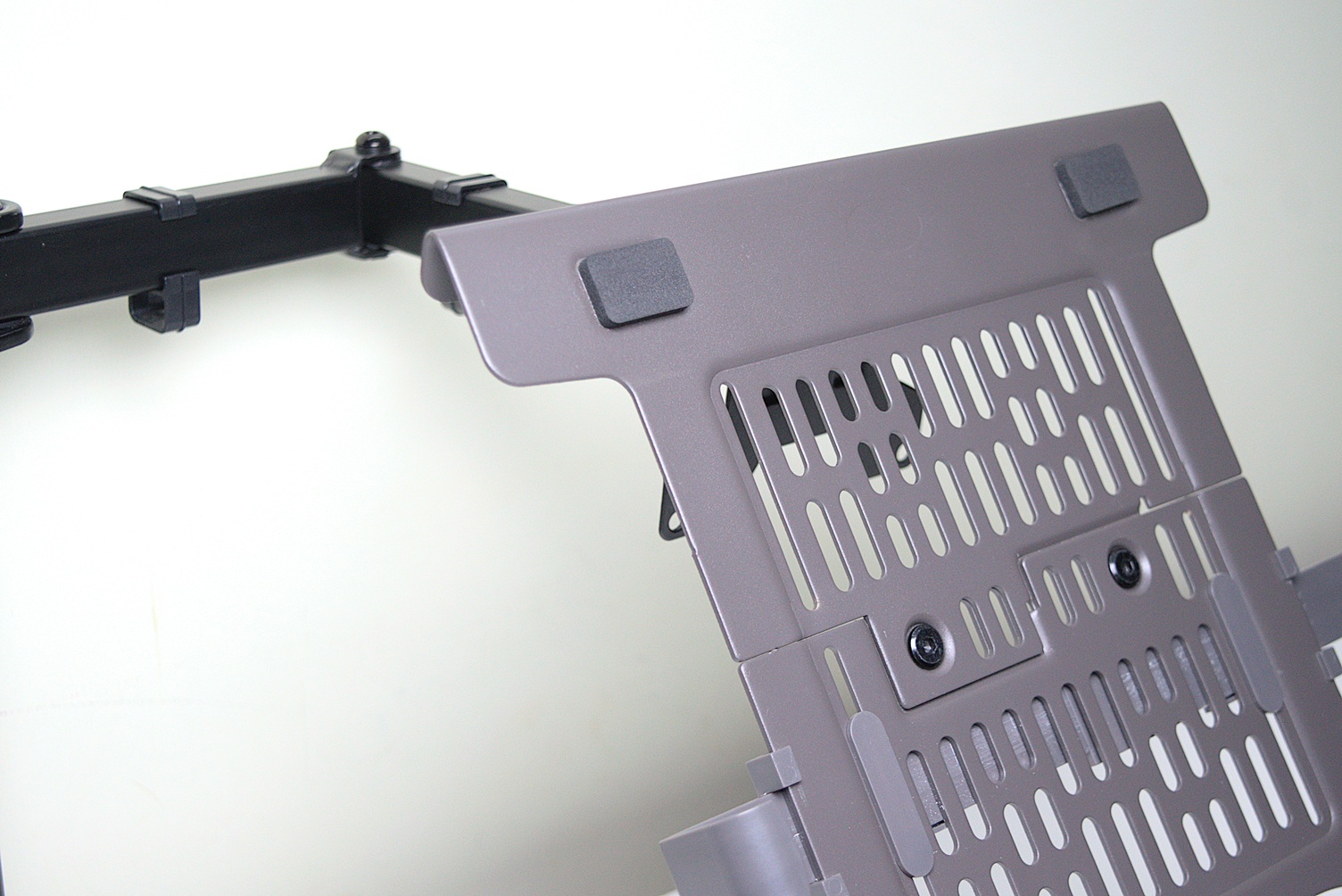 Laptop tray mounted on a monitor arm