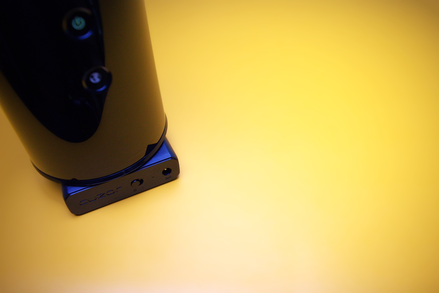 Black Router on top of a black mini UPS