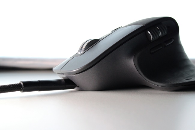 MX Master 3 mouse connected to USB-C, side view