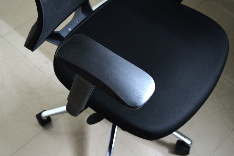 Arm rest of the office chair moved forward