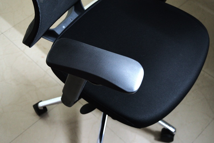Arm rest of the office chair moved to the left