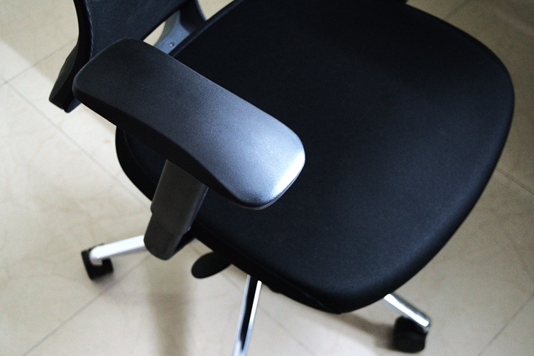 Arm rest of the office chair pulled up