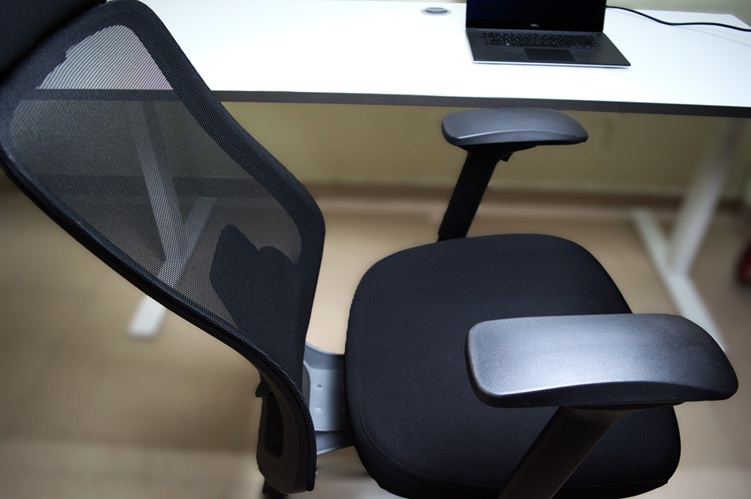 Backrest of the office chair leaned backward