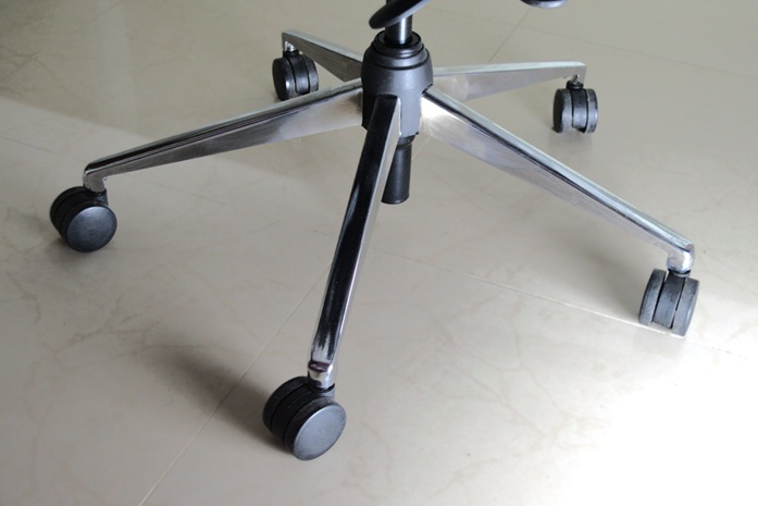 Five leg steel base of the office chair with smooth wheels