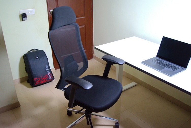 Ergonomic Office chair in a room near a desk with a Dell XPS laptop