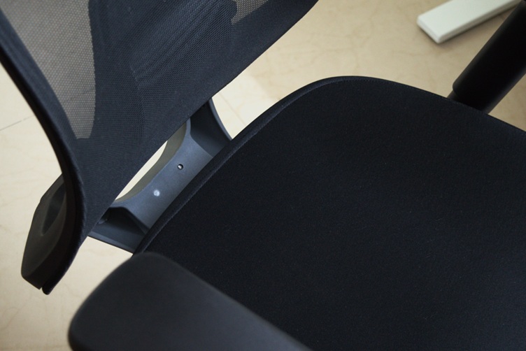 Seat of the office chair moved forward