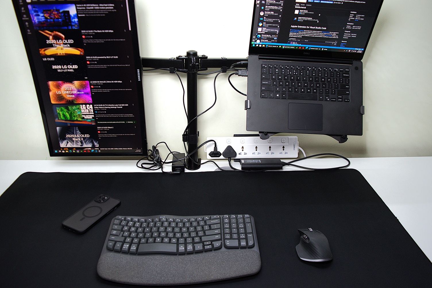 Cluttered desk space with power adaptors