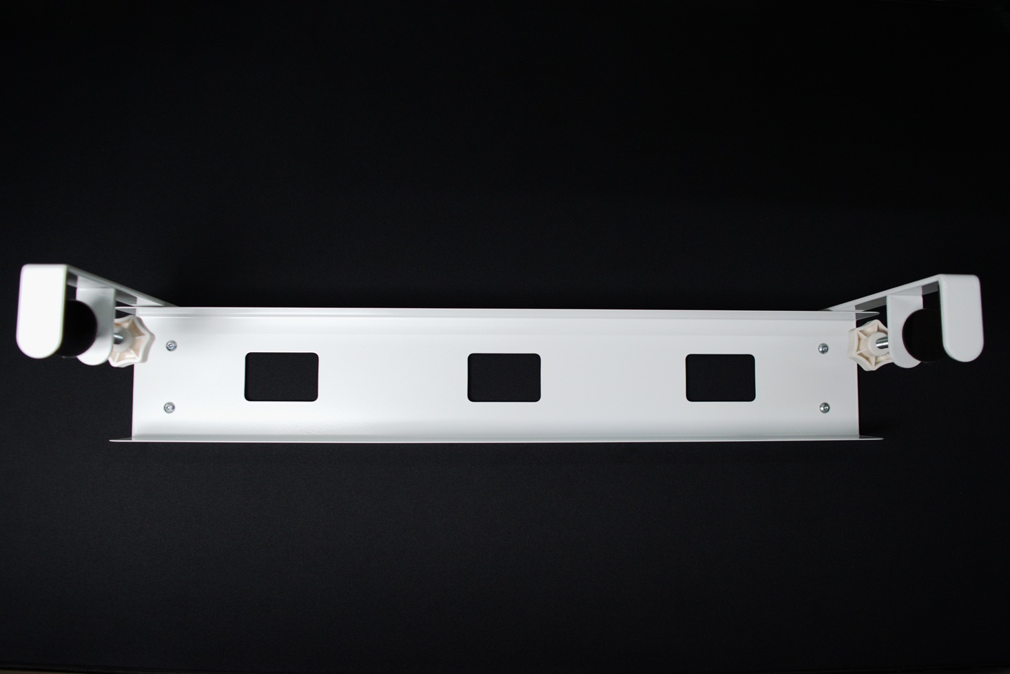 A completely assembled under desk tray