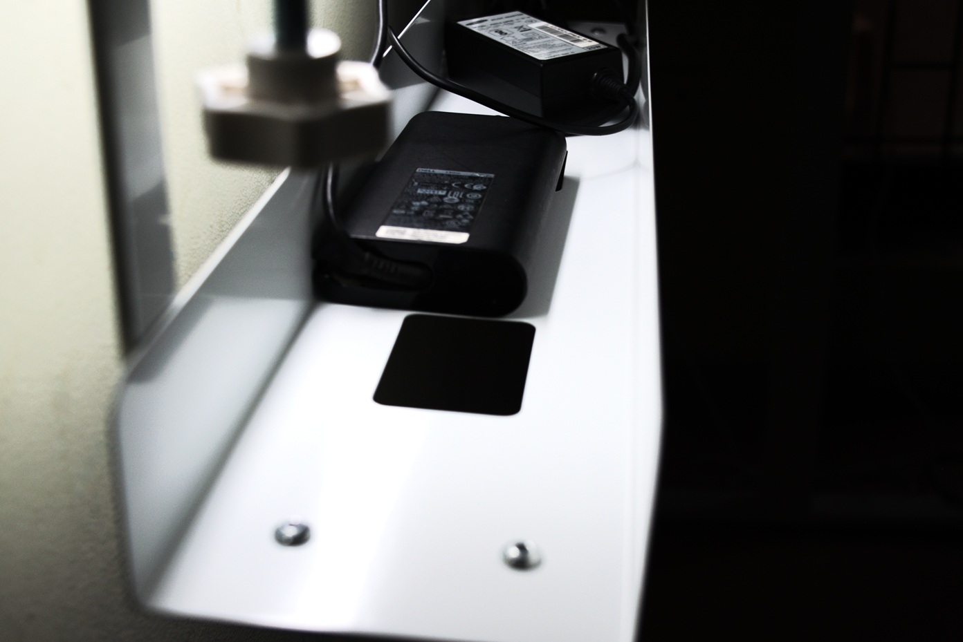 Mounted under desk tray holding the power adaptors