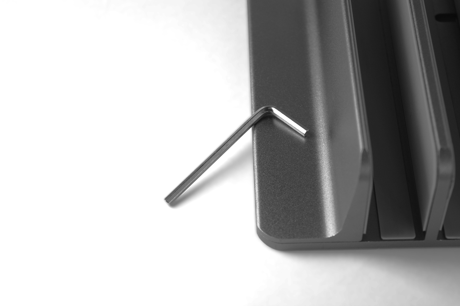 Vertical laptop stand and allen key